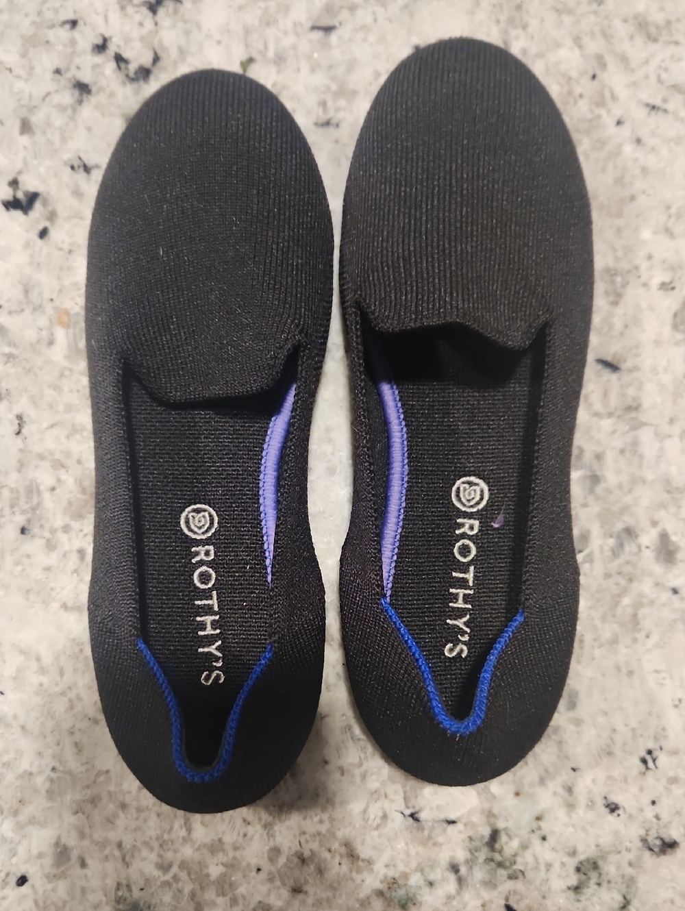 Rothy's Black Knit Slip-Ons with Blue Accent